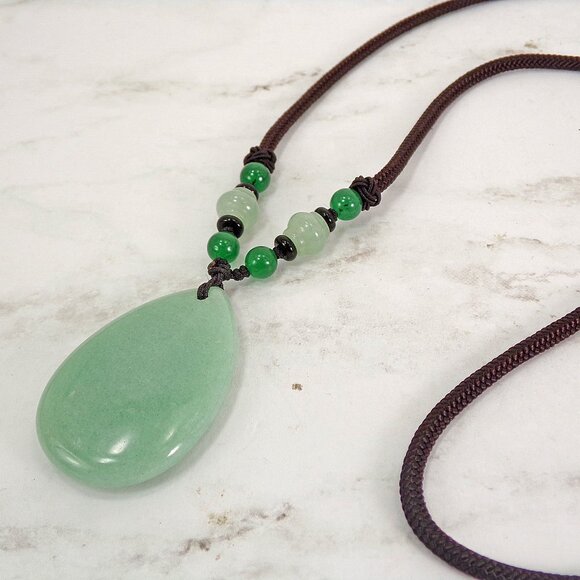 Large green aventurine stone pendant necklace in a teardrop shape on brown cord - Picture 6 of 9